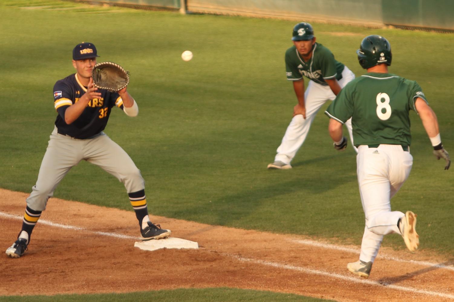 Sacramento State freshman infielder Steven Moretto sprints to first base as Northern Colorado senior first baseman Brett Minnick readies to catch the ball at John Smith Field on Saturday, April 14, 2018. The Hornets lost to the Bears 5-2.