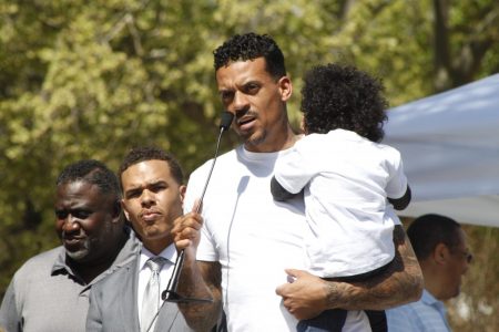 Former Sacramento Kings player Matt Barnes holds one of the children of Stephon Clark, who was recently shot and killed by police, during the March and Rally for Action on March 31, 2018. Barnes created the event to spread awareness of the shooting and preach change.