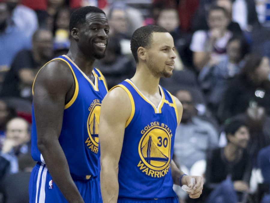 Steph Curry and Draymond Green of the Golden State Warriors come onto the floor of Capital One Arena in Washington, D.C. on Feb. 28, 2017. Curry, Green, and the rest of the Warriors have built up a substantial bandwagon fan base with their success. 