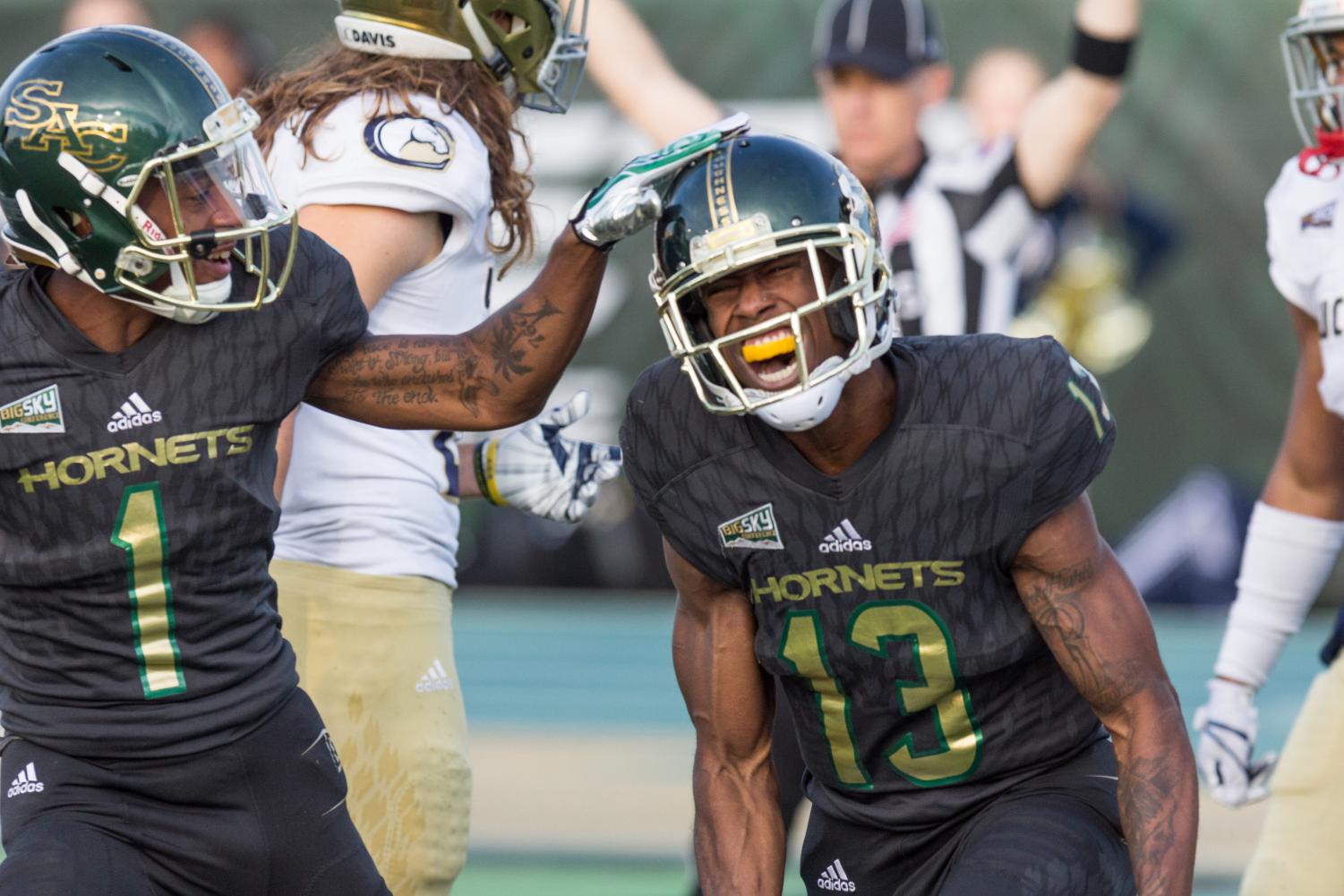Sacramento State senior receiver Isiah Hennie sprints away from a UC Davis defender in the 64th annual Causeway Classic at Hornet Stadium on Saturday, Nov. 18, 2017. Sac State defeated the Aggies 52-47.