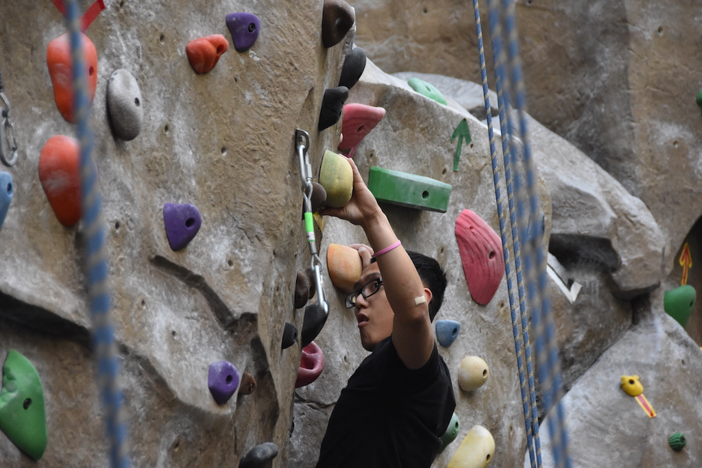 Ethan Veslenio, who joined the rock climbing club this semester, scales a rock wall in the WELL on Thursday, May 3. Sac State's rock climbing club was voted in as the best sports/recreation club on campus for the Best of Sac State.