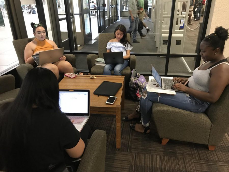 Sac State students Jessica Spicer, Gina Lee, Karla Alvarez and Marissa Ramirez gather together in the library for a group study. 