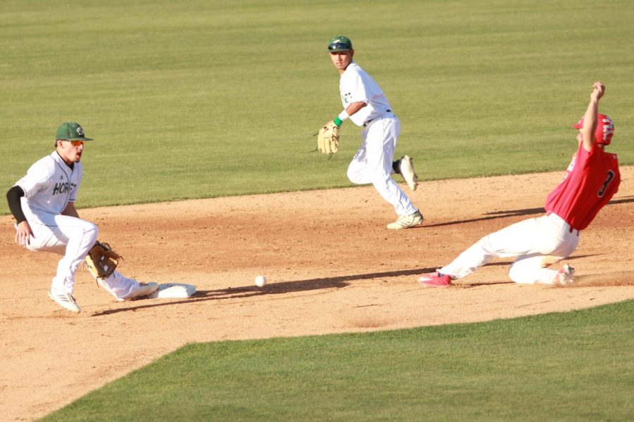 Sacramento State sophomore infielder Josh Urps, left, prepares to catch the ball as Hornets freshman infielder Keith Torres, back, backs up the throw to second as University of Arizona freshman outfielder Donta Williams, right, slides in safely on Monday, May 14, 2018 at John Smith Field. The Hornets lost to the Wildcats 5-2.