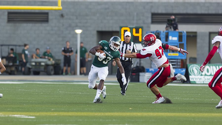 Sacramento State freshman running back and kick returner Elijah Dotson attempts to avoid a defender during Sep.9 game against Incarnate Word at Hornet Stdium. The kick return is one of the most exciting plays in football, but might go extinct due to concerns for player safety. 
