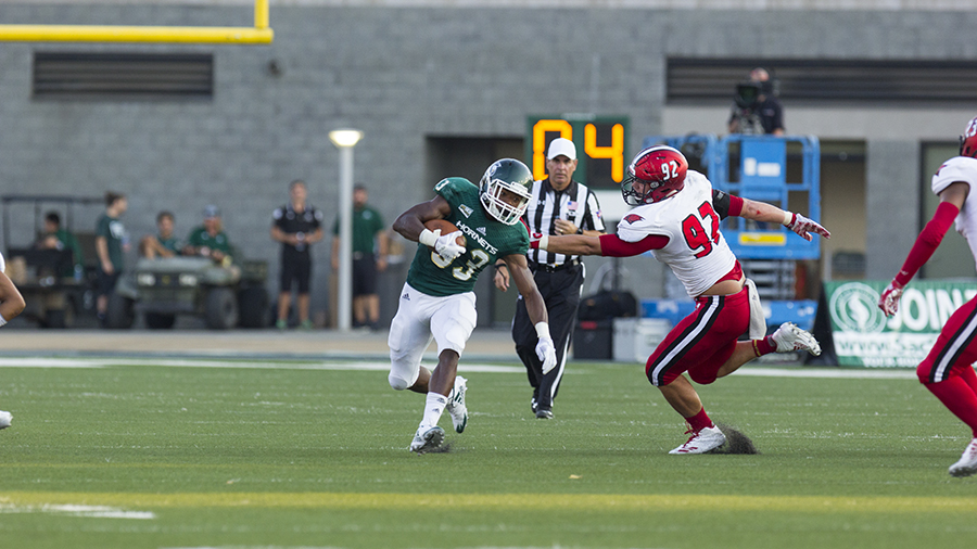Sacramento State freshman running back and kick returner Elijah Dotson attempts to avoid a defender during Sep.9 game against Incarnate Word at Hornet Stdium. The kick return is one of the most exciting plays in football, but might go extinct due to concerns for player safety.