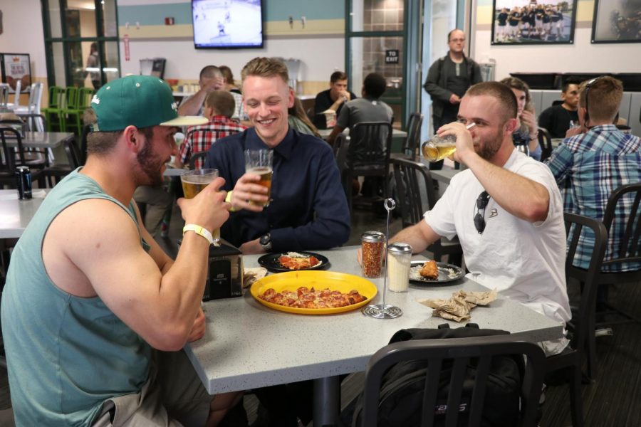 Students drinking beer inside Round Table