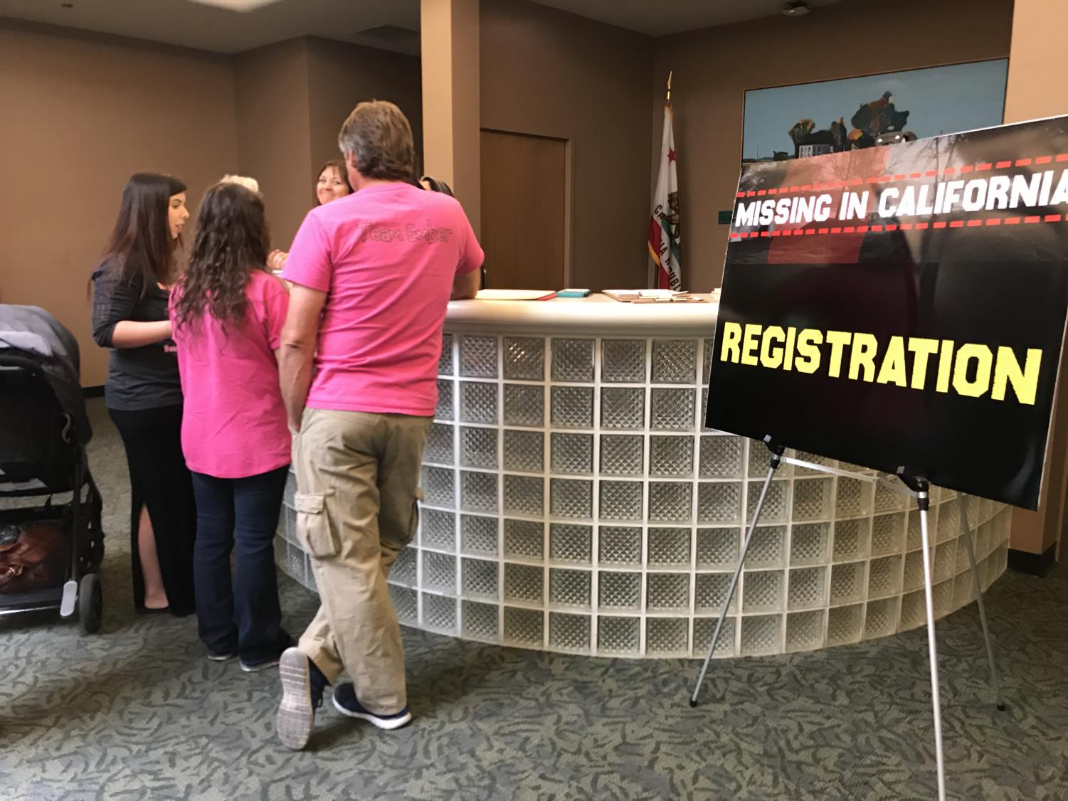 A family checks in at the registration area at the Missing in California conference held at Sacramento State Saturday. A spokesperson from the Sacramento County Sheriff's department said the goal of the conference was to bring clarity to the family members and friends of those who have gone missing.