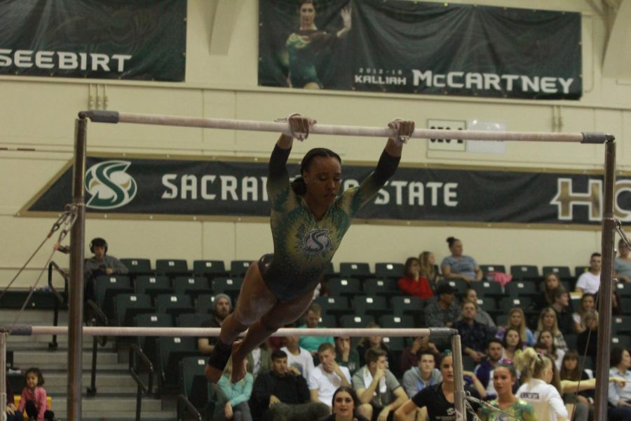 Sophomore Jordyn Brent competing on the uneven bars on March 9 at the Nest. Cal and Stanford headline the teams coming to Sacramento this season.