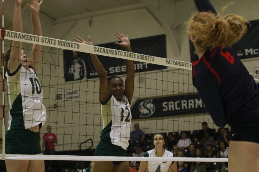 Sacramento State freshman Ashtin Olin (10) and senior Brie Gathright (12) attempt to block an Arizona shot on Aug. 25 in the Hornet Invitational at Colberg Court.