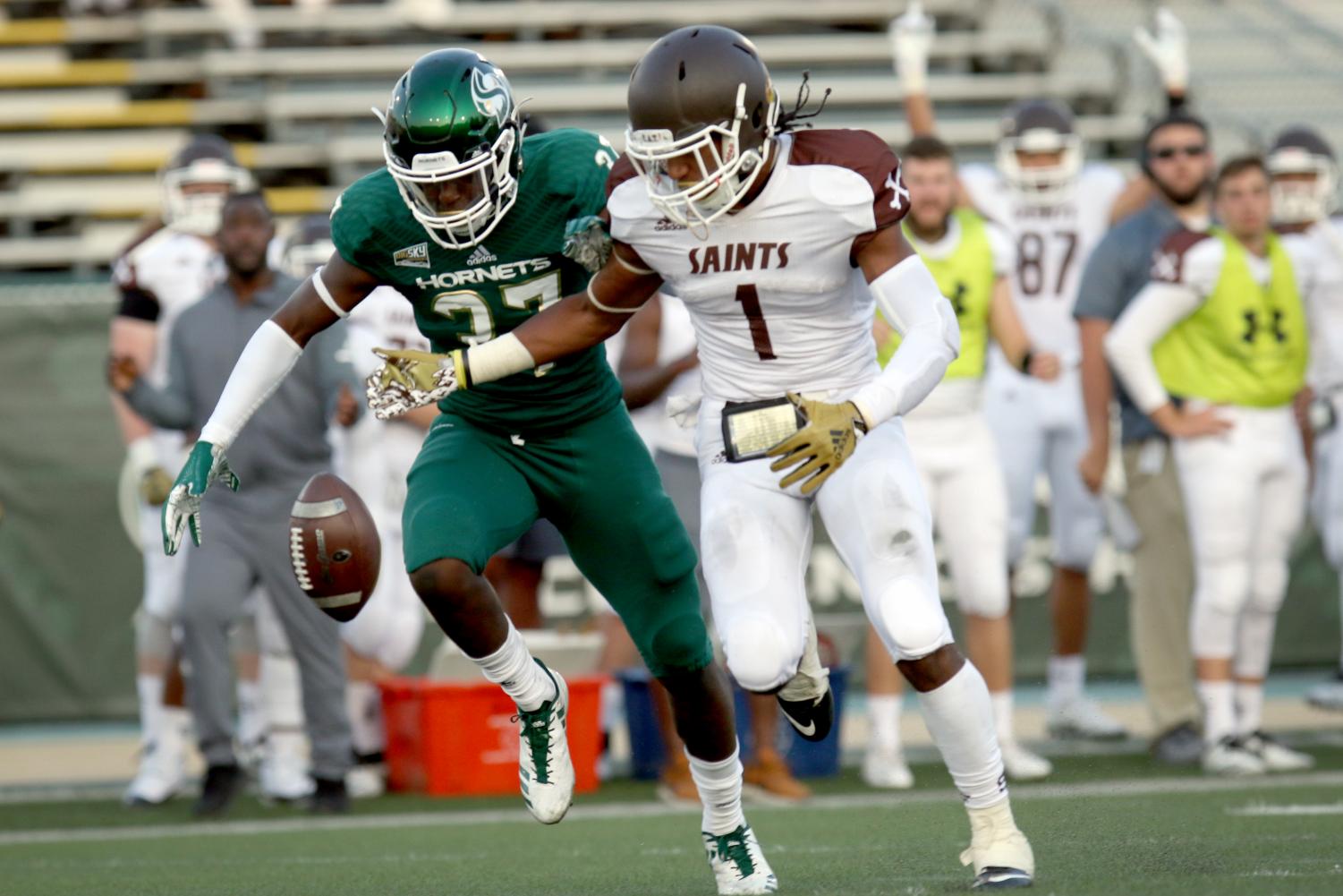 Sacramento State sophomore Daron Bland and Saint Francis wide receiver Ray Vallot watch a pass hit the ground during the first quarter of the Hornets 55-7 win on Sept.1 at Hornets Stadium.