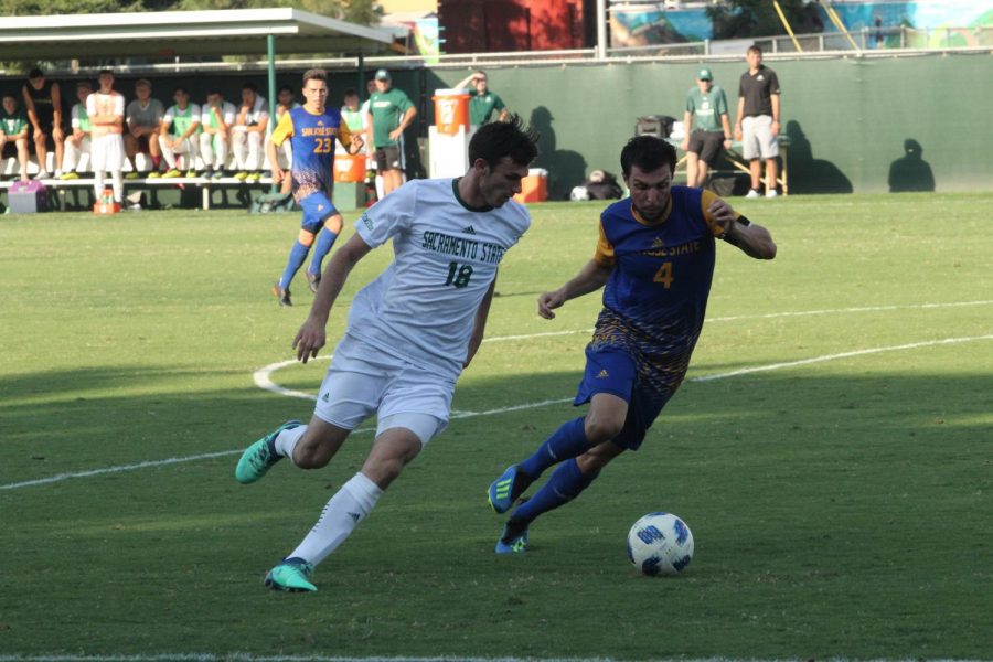Sacramento State senior forward Brad Bumgarner tries to dribble the ball past Joseph Kay of San Jose State to go towards the goal. The Hornets lost their first home match 2-1 against San Jose State on Sept. 2 at Hornet Field.