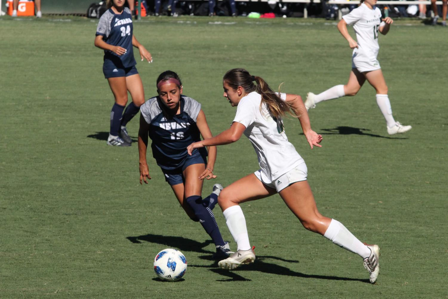 Sacramento State Hornet forward Julia Herrera dribbles the ball past Nevada Wolf Pack forward Analyse Talavera. The Hornets won their first match of the year against Nevada 3-2 on Sept. 7 at the Hornet Field.