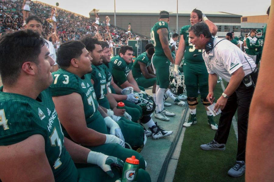 Assistant head coach Paul Wulff speaks with his offensive line during Sacramento State's opener against Saint Francis on Sept. 1. The Hornets fell to San Diego State in their second game 28-14 on Sept. 8.