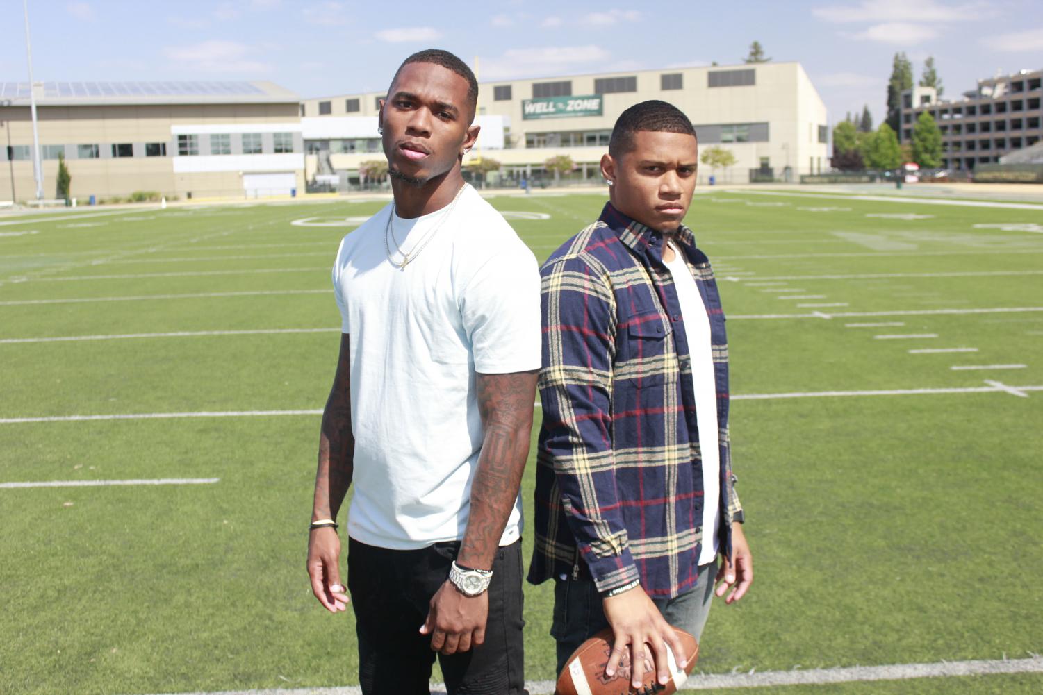 Mister Harriel, left, and Dre Terrell, right, show off their street clothes at Hornet Stadium on Aug. 30, 2018.