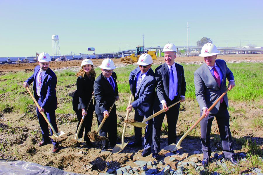 Mayor Darrel Steinberg, second from right, joins others in ceremonially breaking ground at The Crossings in May 2017. The Crossings are now open, joining other student living communities surrounding campus. 