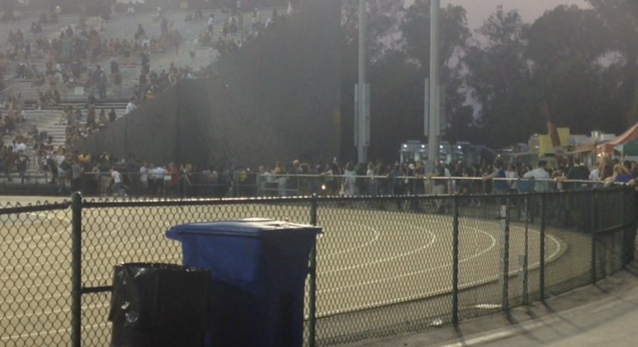 Football game attendees look on as a fight was broken up by Sacramento State Police. Student witnesses said that the fight was started over pizza.