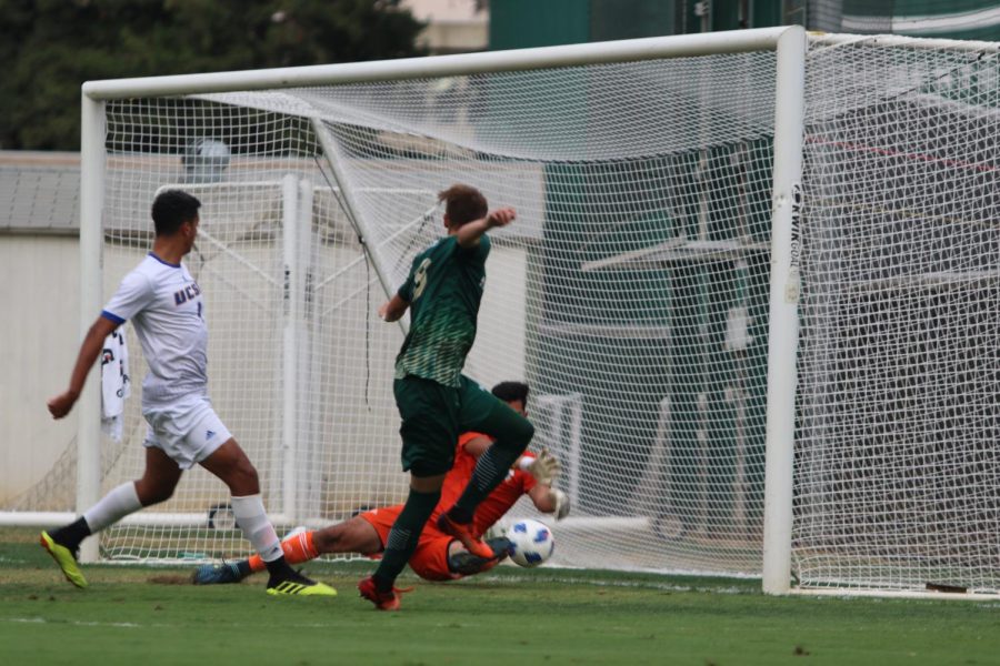 Sac State forward Benji Kikanovic attempts to score a goal, but the ball is blocked by UC Santa Barbara's goalie Alan Carrillo. The Hornets defeated the Gauchos 1-0 in its first Big West Conference match on Wednesday, Oct. 3.