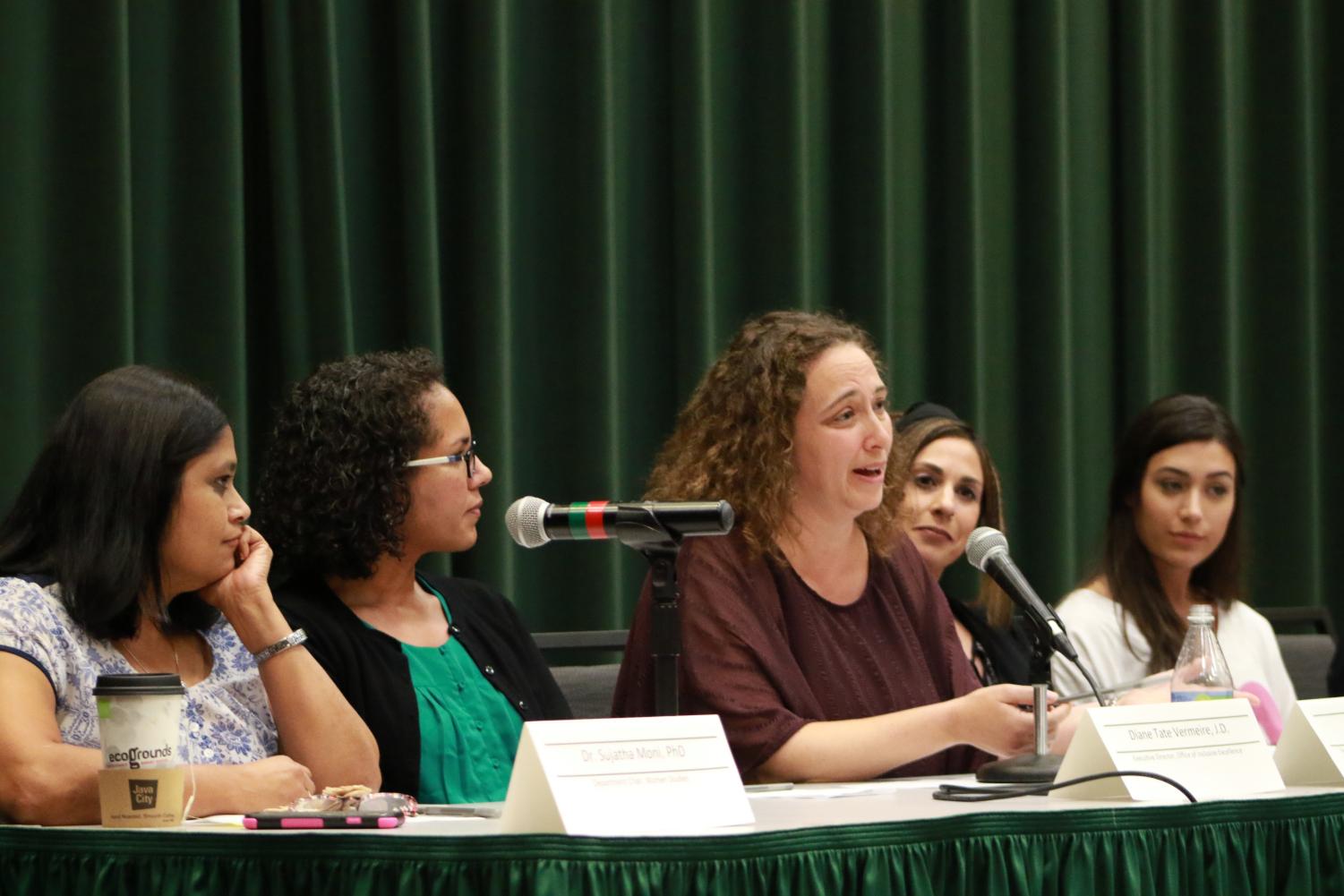 Sujatha Moni, Diana Tate Vermeire, Beth Lesen, Alexa Sardina and Makenzie Neves discuss with students the ramifications of the appointment of Brett Kavanaugh to the U.S. Supreme Court. Panelists discussed concerns with Kavanaugh's partisanship and temperament and compared the treatment of Christine Blasey Ford to Anita Hill.