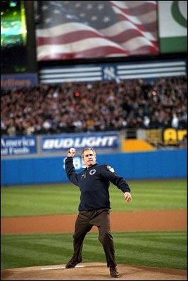 President George W. Bush throws out the first pitch during game three of the World Series game between the Arizona Diamondbacks and the Yankees at Yankee Stadium Oct. 30, 2001.