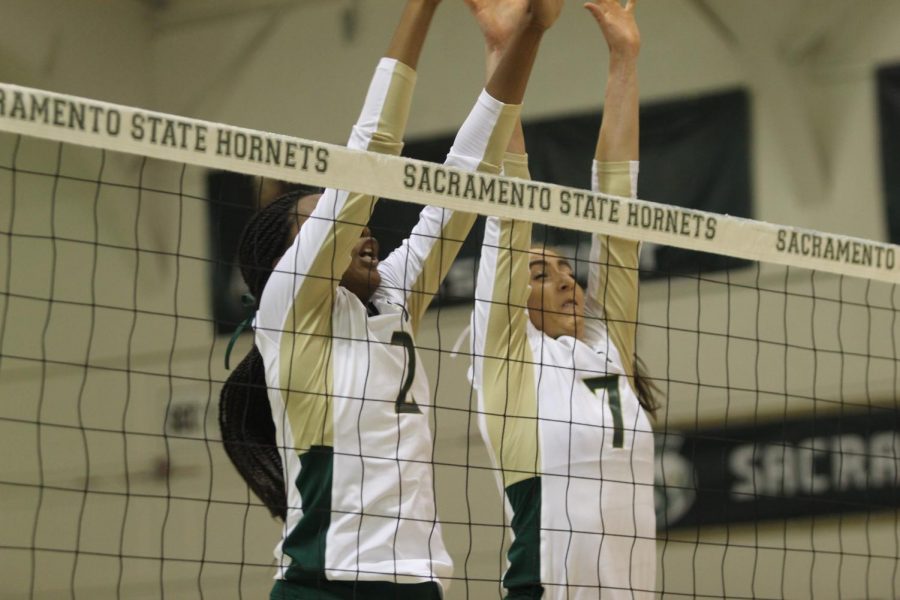 Sac State sophomore middle blocker Cianna Andrews and senior middle blocker Lana Brown go up for a block against UC Davis in the first set on on Sept. 4. The Hornets swept  Southern Utah University on Saturday.