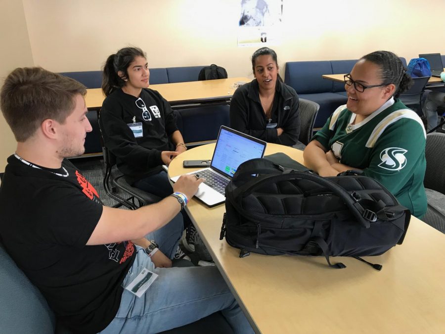 Peer mentors (from left to right) Wilsam Morrav, Jovanna Justo, Dhivya Valluvan and Sage Beamon talk in the First Year Experience Space early in the morning before students come in. The FYE program at Sacramento State welcomes first-year students with the help of two mentorship programs through meetings, classes and support.