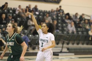 Sac State junior guard Tiara Scott watches as her 3-pointer goes in to give her team a 87-82 lead with 13.5 seconds left in the game against Cal Poly on Nov. 11 at the Nest. The Hornets beat the Mustangs in the season opener 88-85.