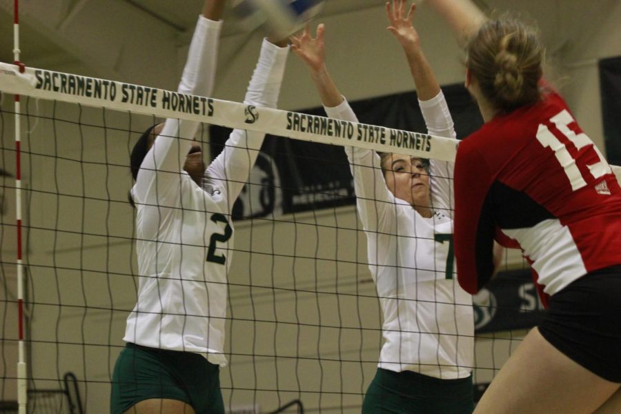 Cianna Andrews (2) and Lana Brown (7) go up for a block in Sac States win over Eastern Washington on Thursday. The Hornets are now 10-3 in the Big Sky Conference. 