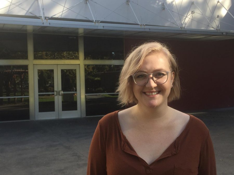 Katelyn Arata stands in front of the theater where the play Peter and the Starcatcher was produced. As a graduating senior, she took the role of assistant director for her last production with Sac State rather than that of an actor.