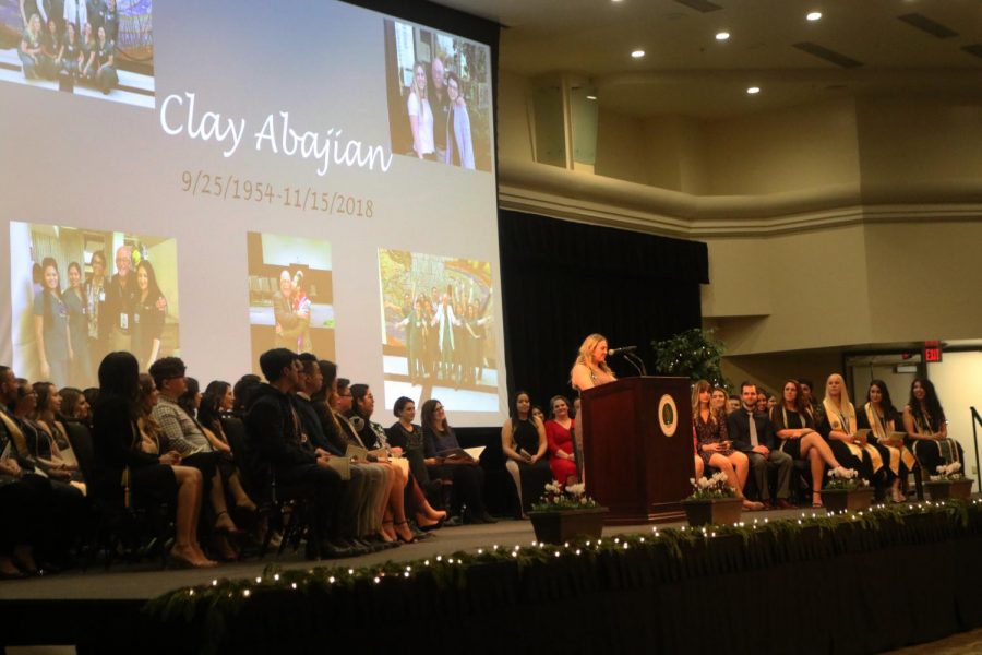 Annie Mantsch reads an in memoriam speech in honor of nursing instructor Clay Abajian at Sacramento States School of Nursing pinning ceremony Thursday in the University Union Ballroom. Abajian was one of two fatalities in a Nov. 15 plane crash in Redding, California.