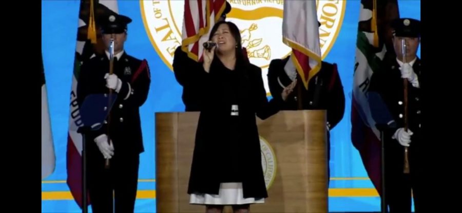 Gaw Vang Williams sings the National Anthem at Governor Gavin Newsoms inauguration in Sacramento, California on Jan. 7. Williams is the vocal jazz director for the Sac State School of Music. 