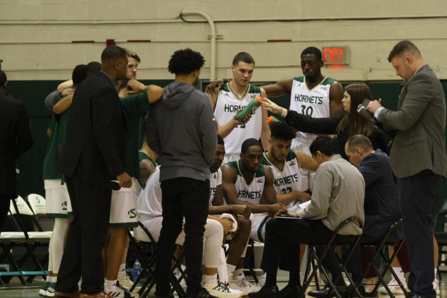 Sac State head coach Brian Katz talks to the Hornets during a timeout. Sac State lost to Northern Arizona 78-66. 