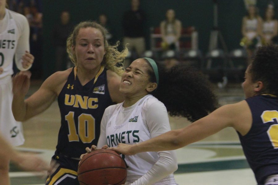 Sac State junior guard Tiara Scott drives to the basket while a Northern Colorado player attempts to steal the ball in a 71-61 loss to the Bears at the Nest on Feb. 11.