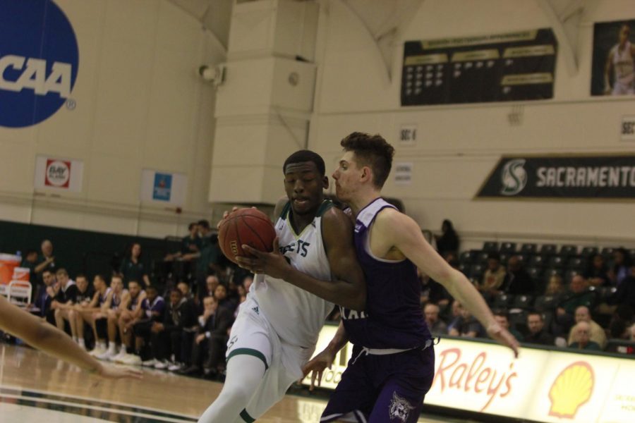 Sac State junior center Joshua Patton drives towards the basket in the Hornets 78-76 win over Weber State on Thursday.