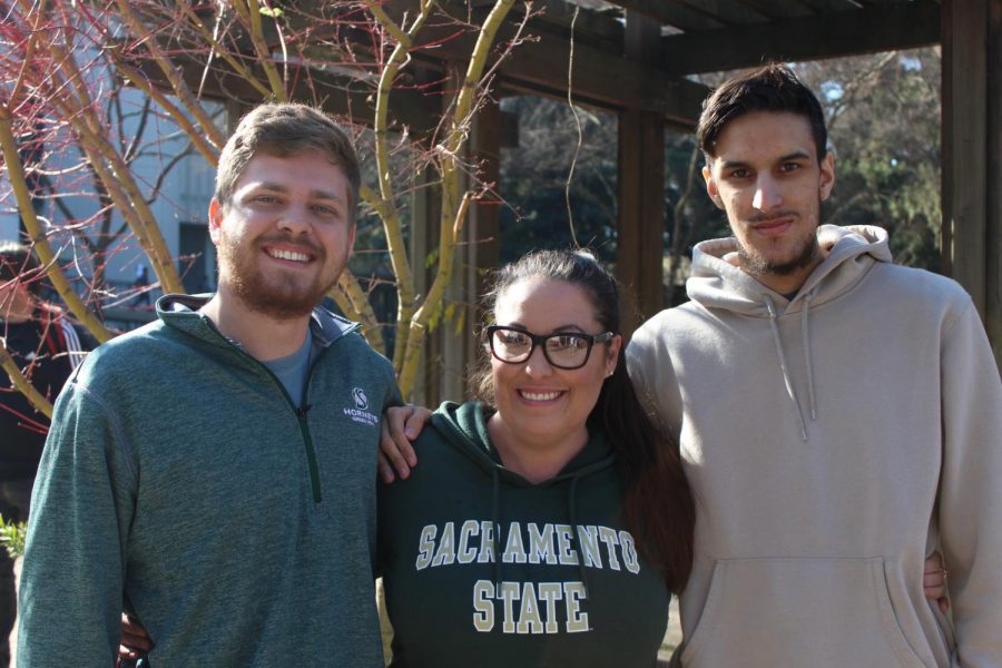 From left to right, Nick Palsgaard, Donna Walters, and Paul Mello stand near the library quad near their booth during club rush. They, along with club members, work toward expanding eSports at Sac State by competing in gaming tournaments. 
