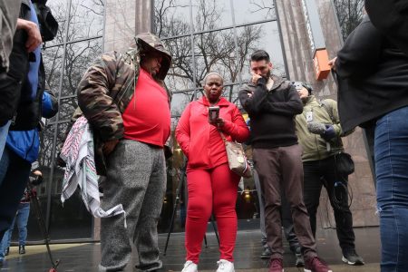 From left, Adam Jordan, Sonia Lewis and Patrick Durant wait outside the Sacramento District Attorneys office Saturday, March 2 as they watch a live video feed of the announcement regarding the fate of the officers involved in the shooting death of Stephon Clark last March. The officers will not be criminally charged for fatally shooting Clark, according to Sacramento District Attorney Anne Marie Schubert.