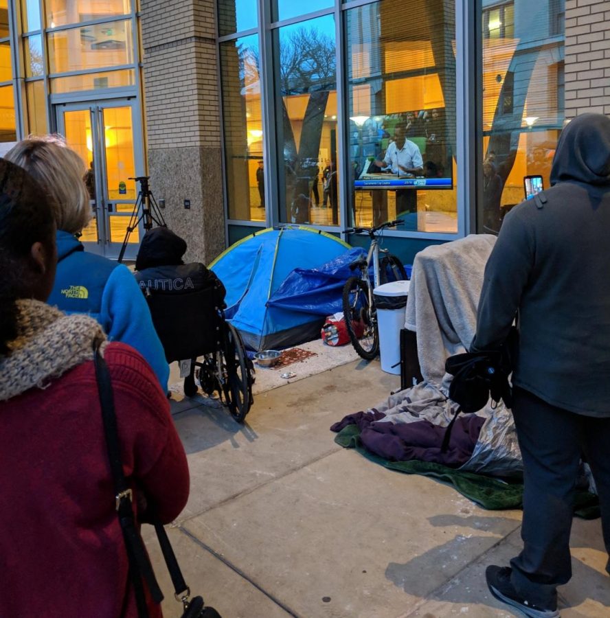 Attendees unable to enter City Hall meeting watch the proceedings from a television outside Tuesday. Large crowds arrived at city hall to express their frustration with the District Attorneys choice to not press charges against the two officers who shot and killed Stephon Clark and Sacramento PDs handling of Monday nights demonstrations.