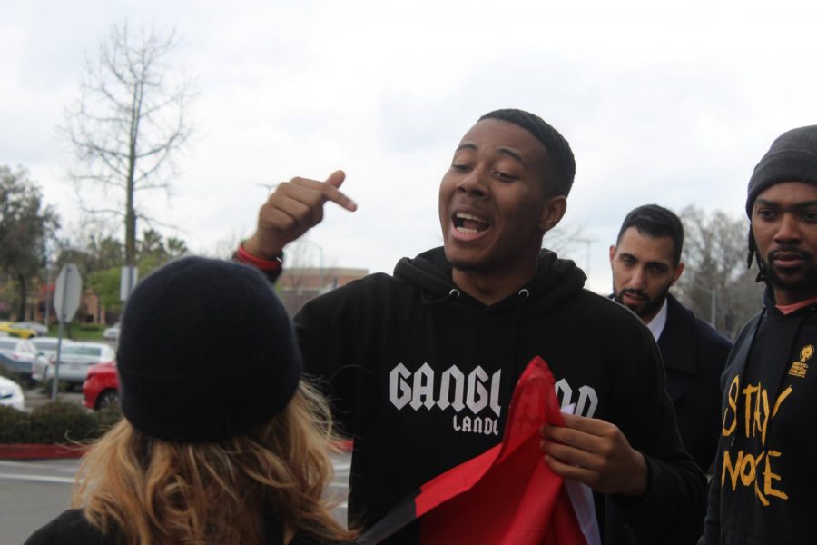 Khalil Ferguson, a Sac State international relations major, chants outside of Arden Fair Mall in Sacramento Sunday. He helped plan the teach in held at the mall that started Saturday and lasted through Sunday.