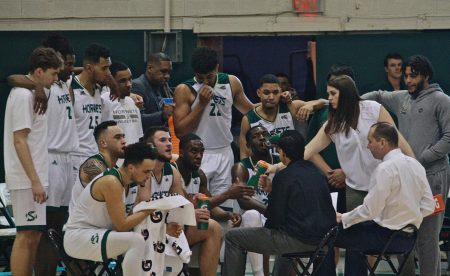 The Sac State mens basketball team listens to head coach Brian Katz during a timeout on Thursday. The Hornets defeated Montana State 70-67 to improve its record to 14-14. 