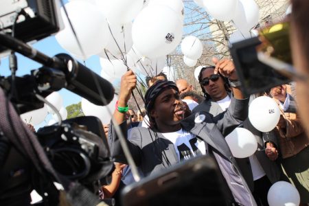 Stevante Clark, Stephon Clarks older brother, holds a set of balloons aloft during a balloon release ceremony held immediately after a service at Genesis Church in Meadowview on Monday. The service was part of the one-year anniversary remembrance of unarmed 22-year-old Clark, who was shot and killed by Sacramento Police on March 18, 2018.