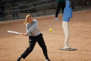 Coach Lori Perez hitting a softball while conducting fielding drills during practice at Shea Stadium on Jan. 31, 2018. Perez is one of the only two women head coaches at Sac State. 