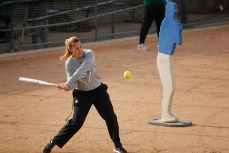 Coach Lori Perez hitting a softball while conducting fielding drills during practice at Shea Stadium on Jan. 31, 2018. Perez is one of the only two women head coaches at Sac State. 