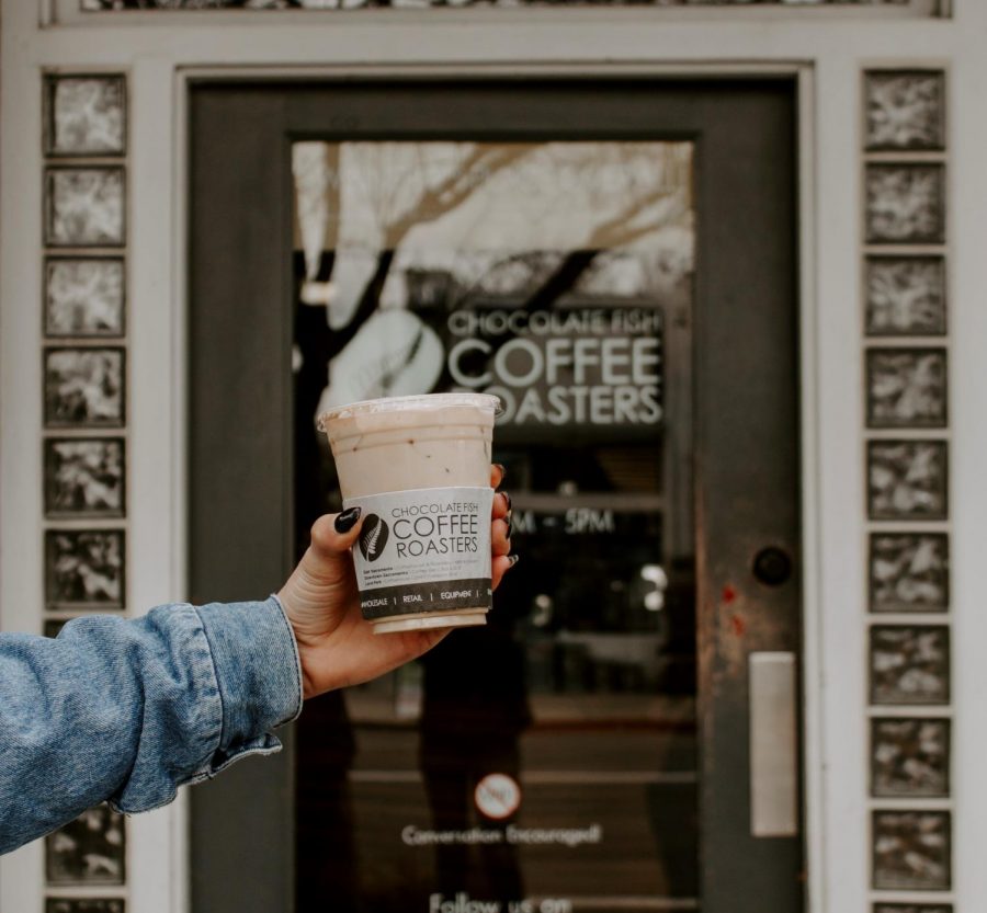 An iced vanilla latte in front of Chocolate Fish Coffee Roasters on Feb. 24. Order an iced latte for a quick caffeine fix to get you through the day.