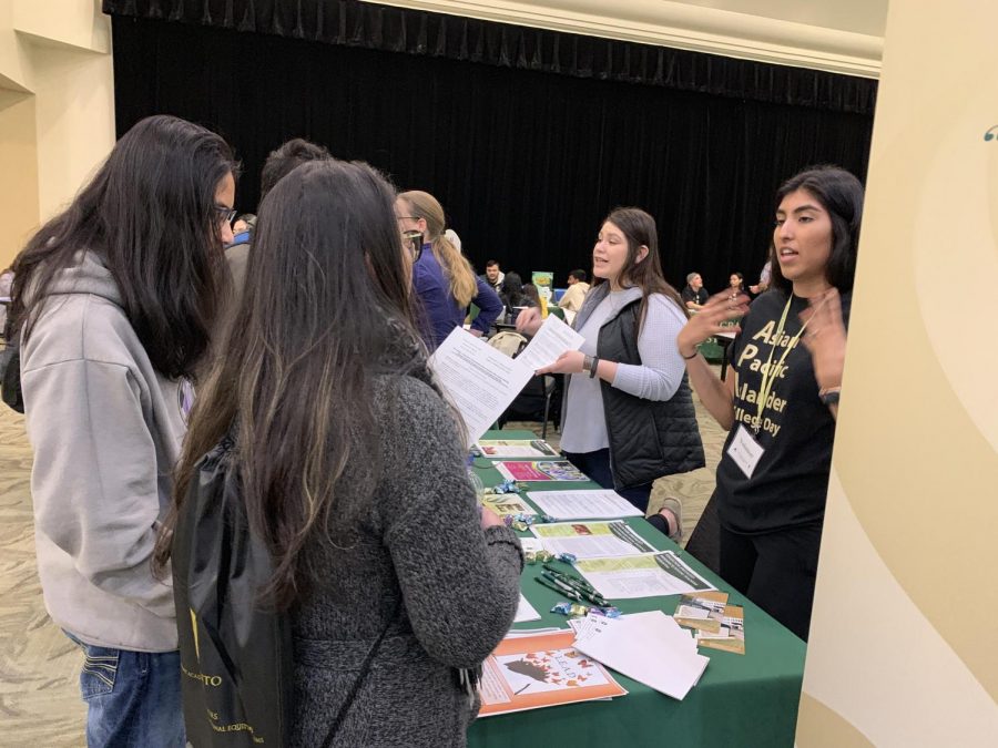 Students talk to college organizations in the University Union ballroom on Friday, March 29 during Asian Pacific Islander College day. Students were able to talk to different organizations and departments about what university resources are offered. 