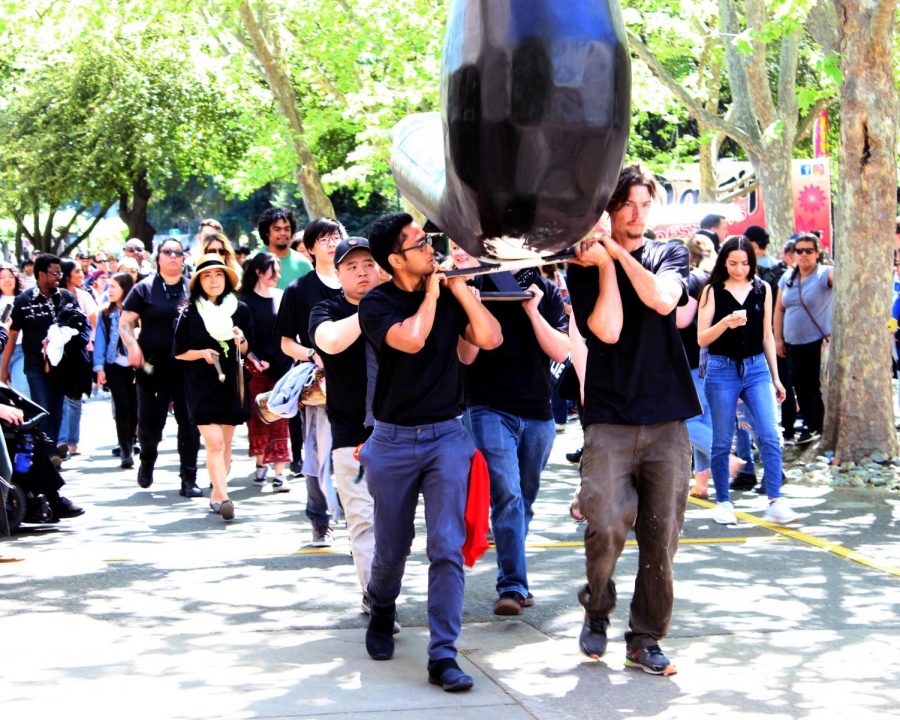 A large group of students followed behind the coffin on it's journey to Kadema hall. The coffin would sit in Kadema hall until around 4 p.m. when it was taken back to the sculpture lab to be completed.