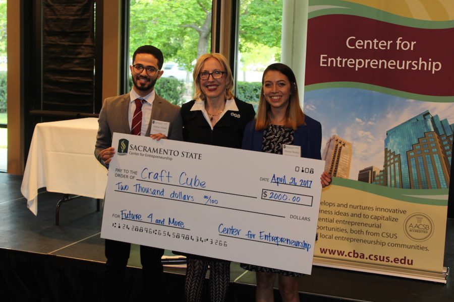 Previous Future Four & More winners team of Marissa Mendez, marketing and national business major,  and graduate electrical engineering student Ammar Ahmed present Craft Cube, a four-in-one user-friendly device that can 3D print, 3D scan, laser cut and mill, in April of 2017 at the Alumni Center. 