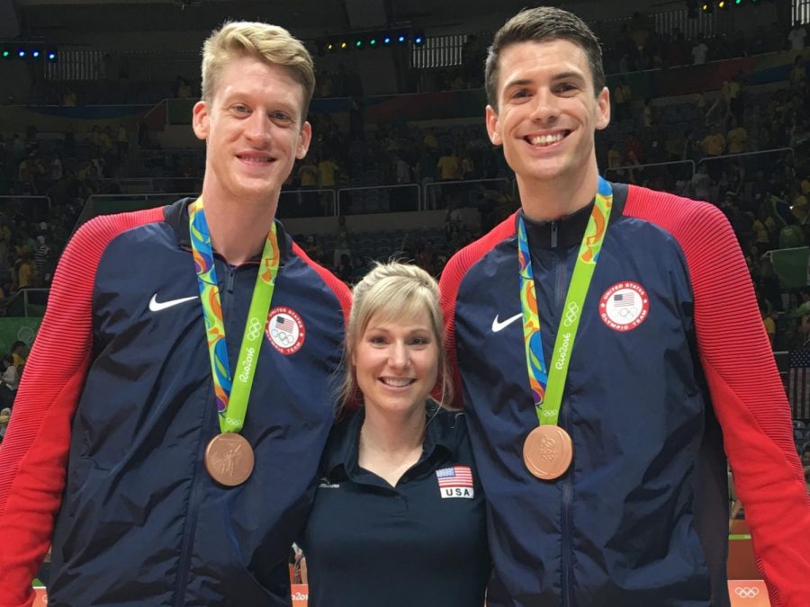 Andrea Becker poses for a photo between US National volleyball players Max Holt and Matt Anderson. The team won bronze at the 2016 Olympics. 