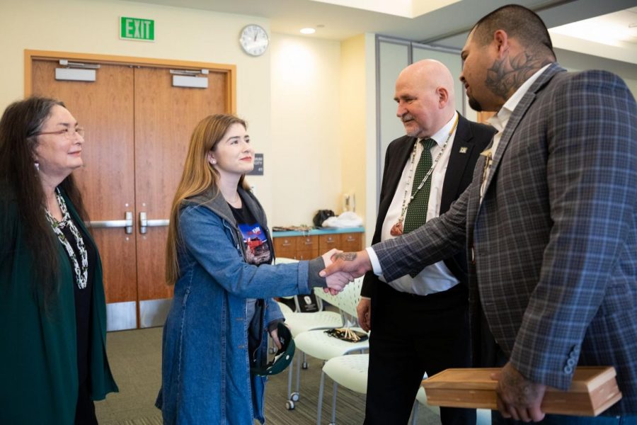 Sac State scholarship recipient Jordan Hernandez, shakes hands with Tribal Treasurer Matthew Lowell Jr. on March 6. On that day, the Yocha Dehe Wintun Nation announced their $750,000 donation to the Native American program at Sac State.