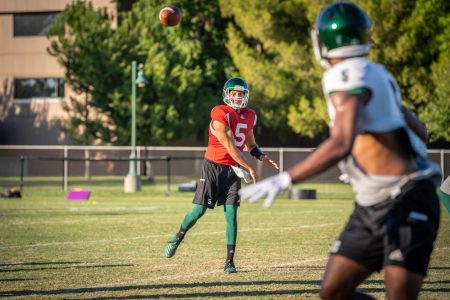 Sac State junior quarterback Kevin Thomson throws a pass during training camp on Tuesday, August 12 at the practice field. Thomson averaged 9.52 yards per completion in 2018, ranking second in program history only trailing the record he set in 2017. 