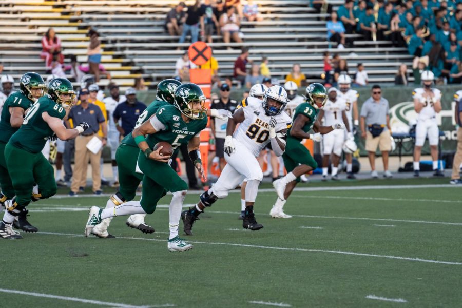 Sac State junior quarterback Kevin Thomson rushes for a first down against Northern Colorado on Saturday, Sept. 14, at Hornet Stadium. The Hornets play on the road this Saturday at Fresno State.