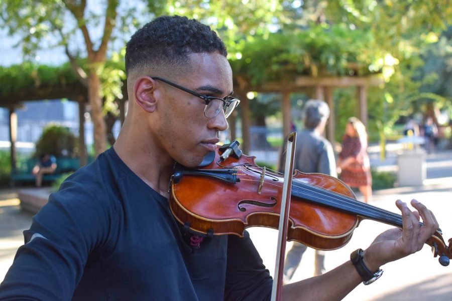 Matthew Major plays the violin in the Library Quad at Sacramento State on Sept. 23, 2019. The Matthew Major Inception Quintet, a jazz group comprised of Sac State music students, will be performing at UNIQUE Programs’ Wednesday Nooner in the Serna Plaza.